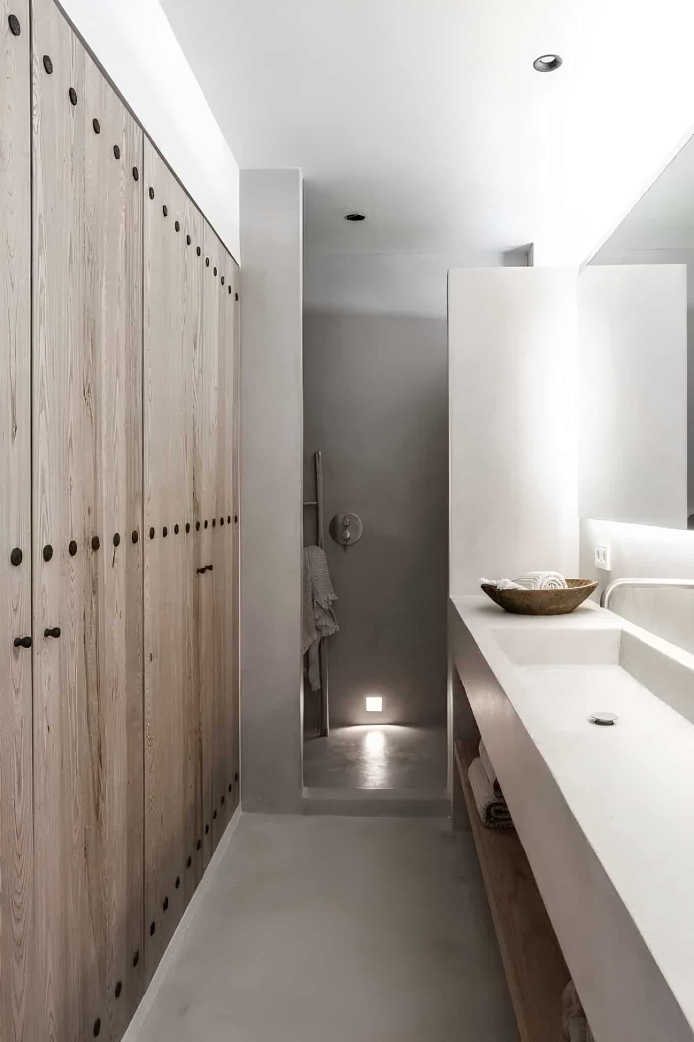 Mediterranean Style Fireplace Wall Decor Fireplace wall with ceramic decor, shelf, and woven elements in Mediterranean home.