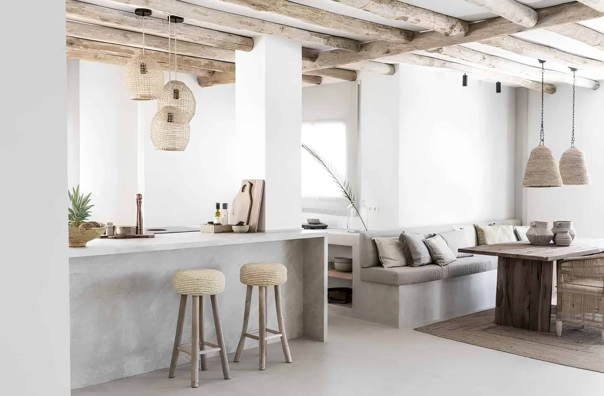 Mediterranean Style Kitchen Island Microcement Natural Wood Mediterranean kitchen island with microcement finish and natural wood ceiling beams.