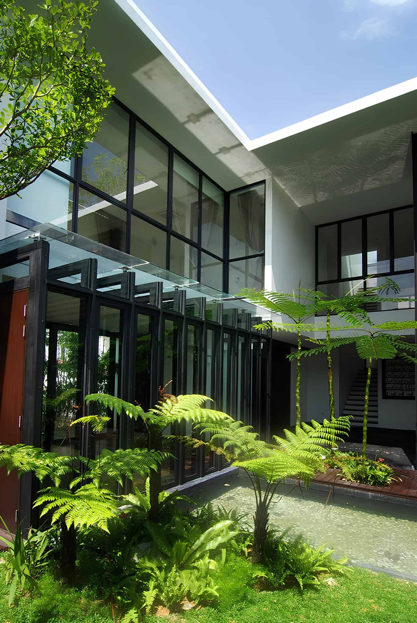 Jalan Merlimau Inner Courtyard Garden Lush inner courtyard garden with ferns and water feature at Jalan Merlimau.