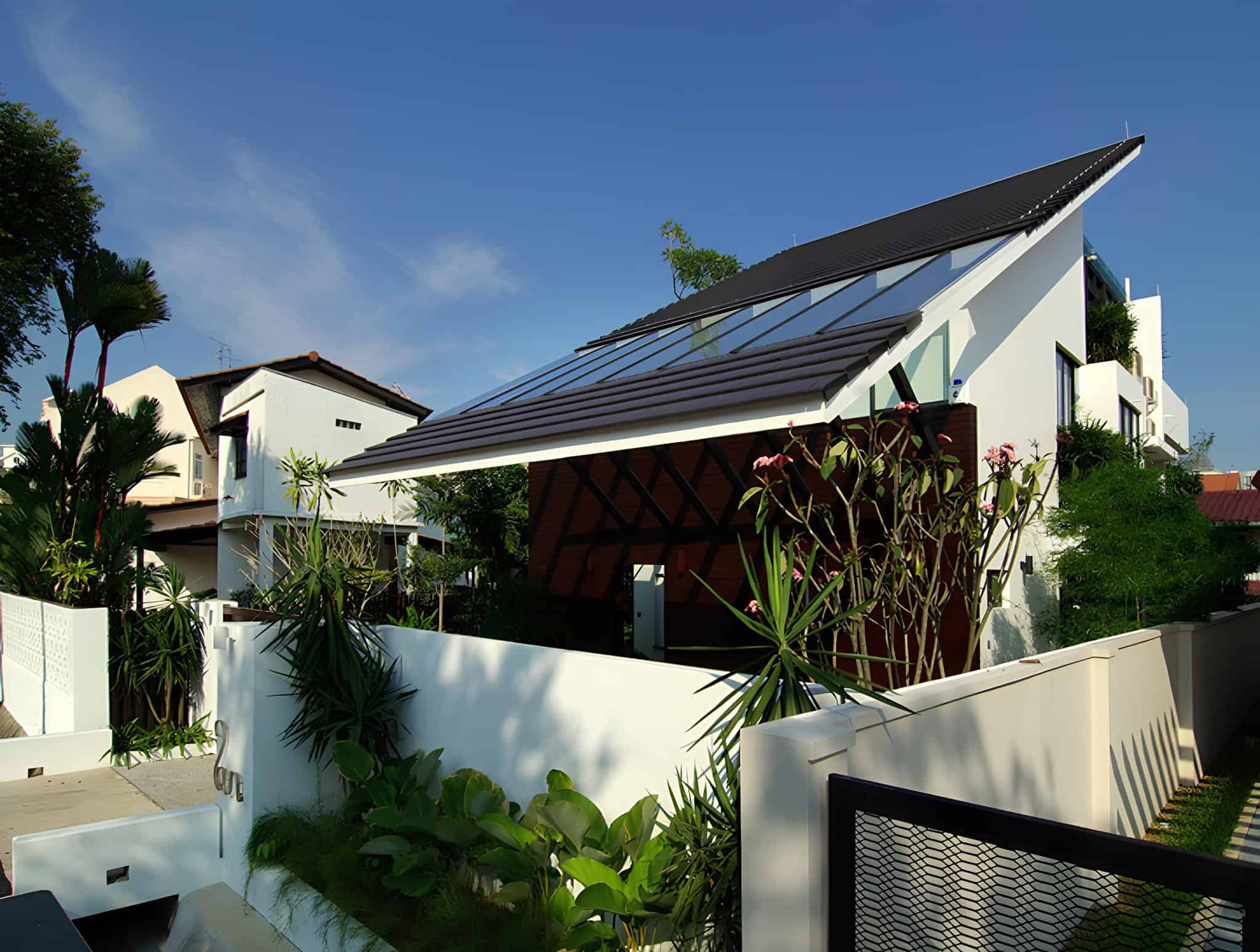 Jalan Merlimau Street View Angled Entry Angled view of the entrance to Jalan Merlimau featuring planted walls and tiled roof.