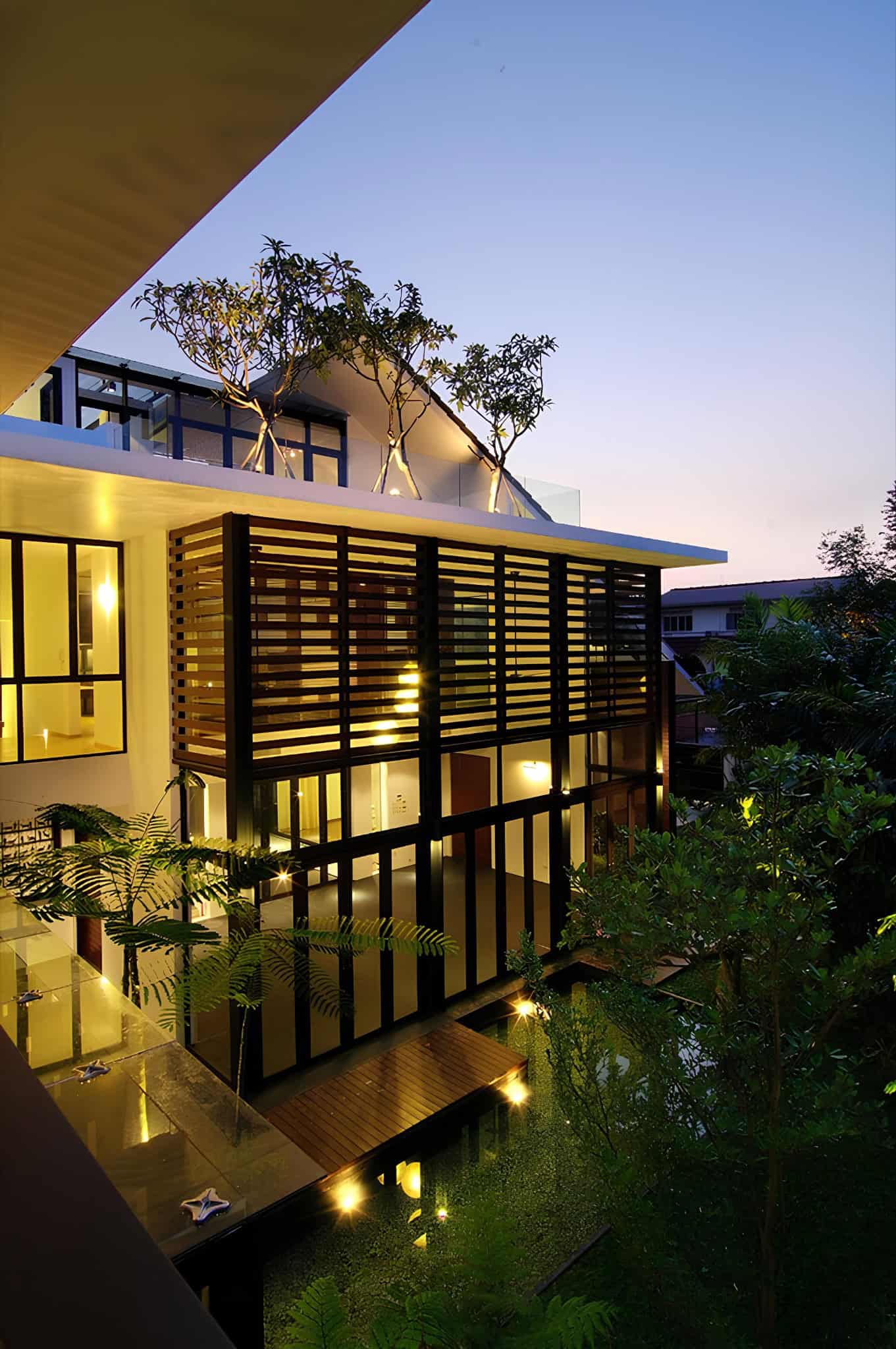 Jalan Merlimau Wooden Screen Dusk View Architectural timber screen and upper garden glowing under dusk light at Jalan Merlimau.