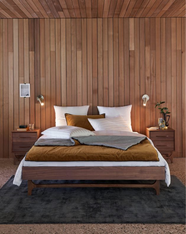 A cozy bedroom in dark wood