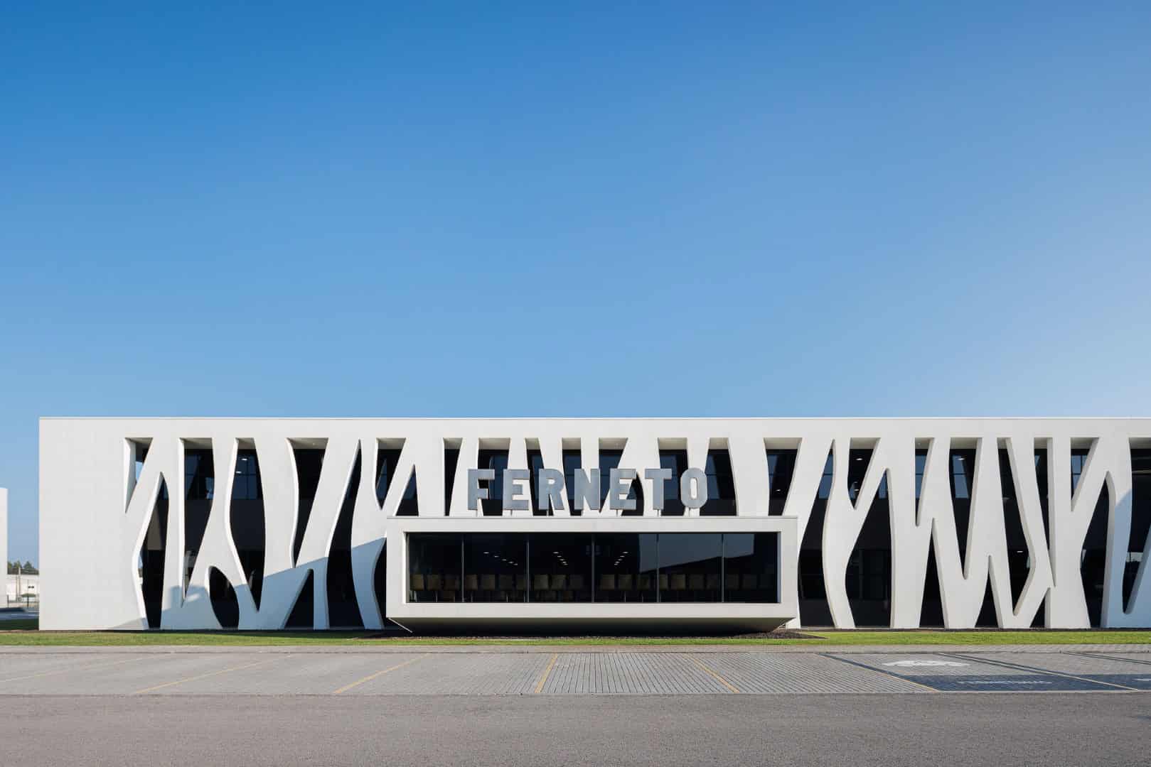 Sleek modern architecture building with stylish white exterior and unique design elements, showcasing innovative architectural art and design.