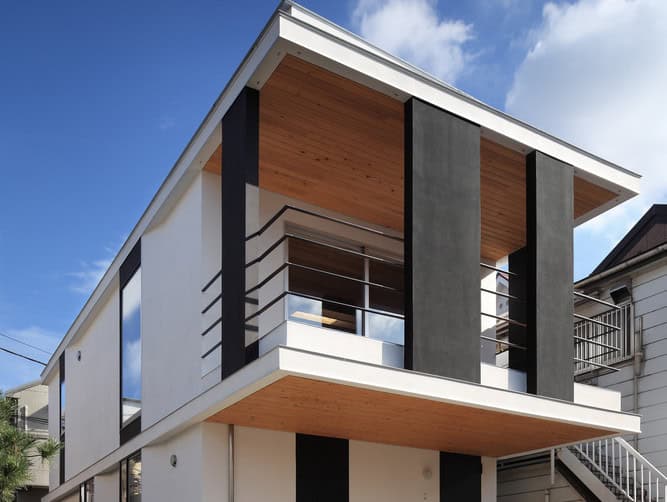 Modern minimalist house exterior with clean lines, black and white color scheme, and wooden accents, showcasing contemporary architecture and innovative design.