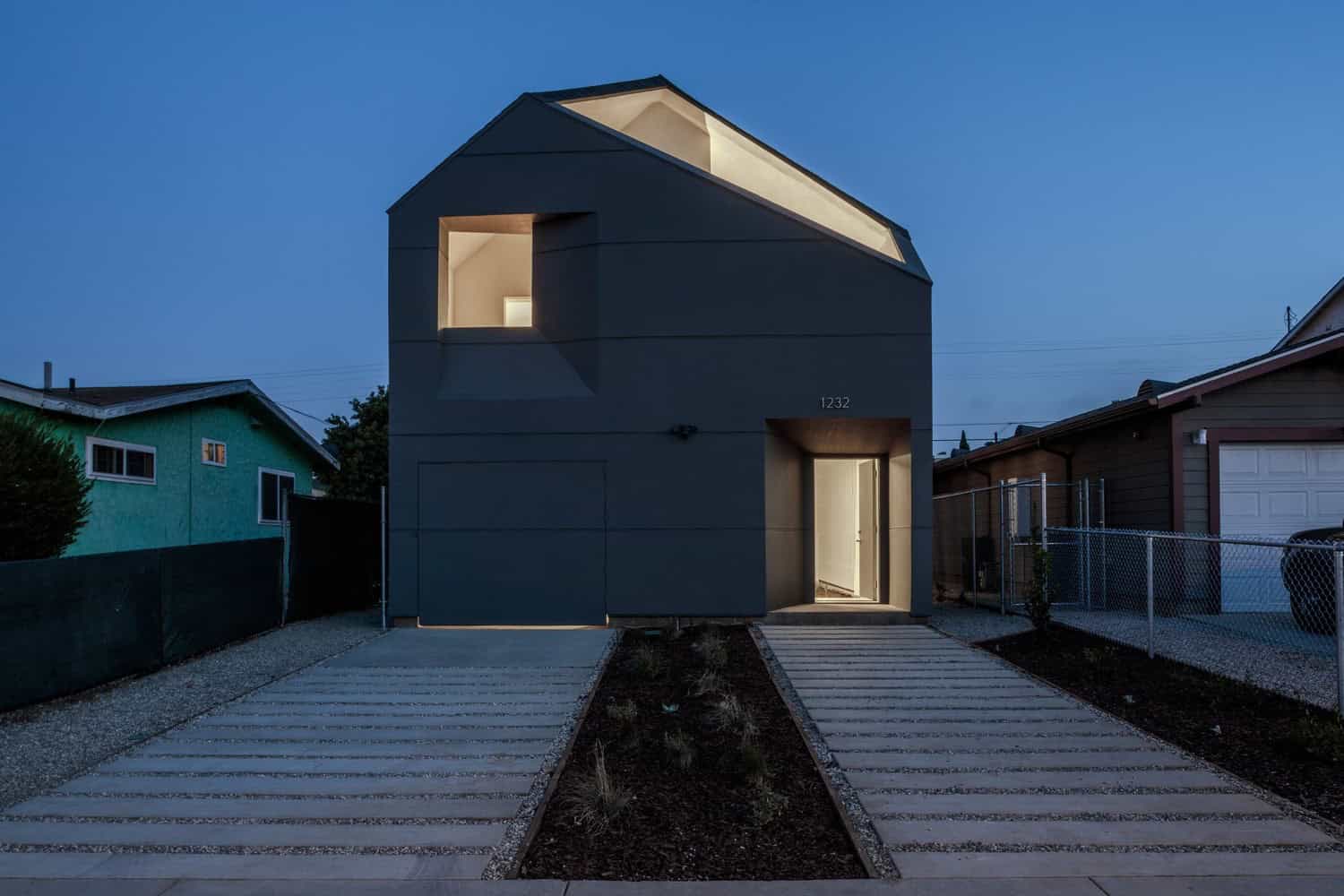 Contemporary modern house with sleek design and minimalist architecture, illuminated at dusk, showcasing innovative residential architecture and stylish home exterior design.