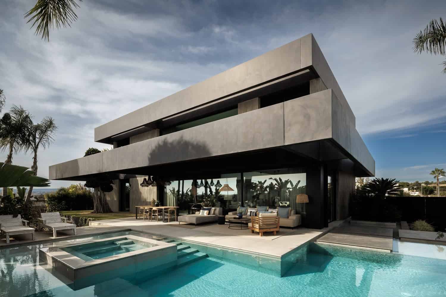 Modern luxury house with swimming pool, outdoor seating, and contemporary architecture, featuring clean lines and minimalist design, perfect for upscale residential projects.