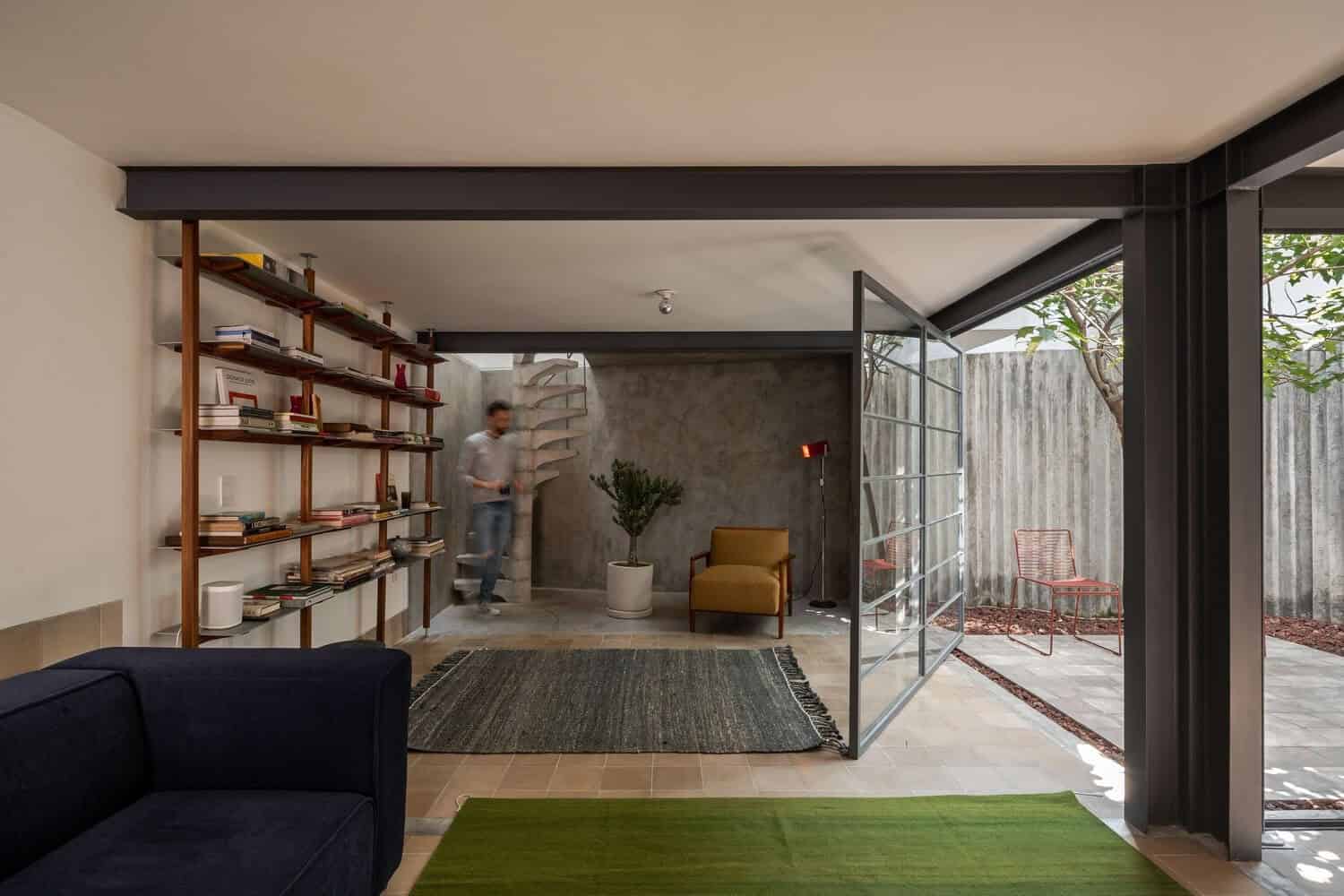 Contemporary living room with modern architecture, open layout, natural light, and stylish furnishings. Stylish interior design blending minimalist and industrial elements for a cozy yet sophisticated atmosphere.