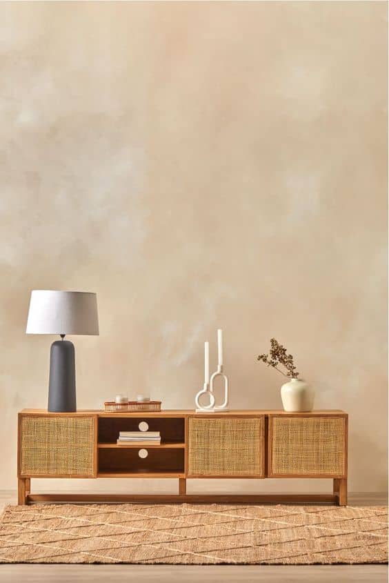 Ceramic table lamp, minimalist home decor, beige textured wall, mid-century modern wooden console, decorative vases, neutral color palette, stylish interior design, cozy living space, Scandinavian interior inspiration, modern home accessories.