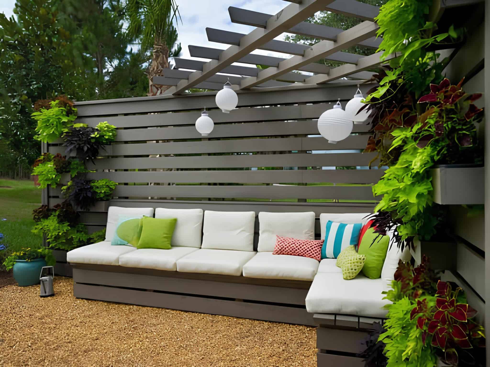 Modern pergola with horizontal privacy slats and vibrant potted plants