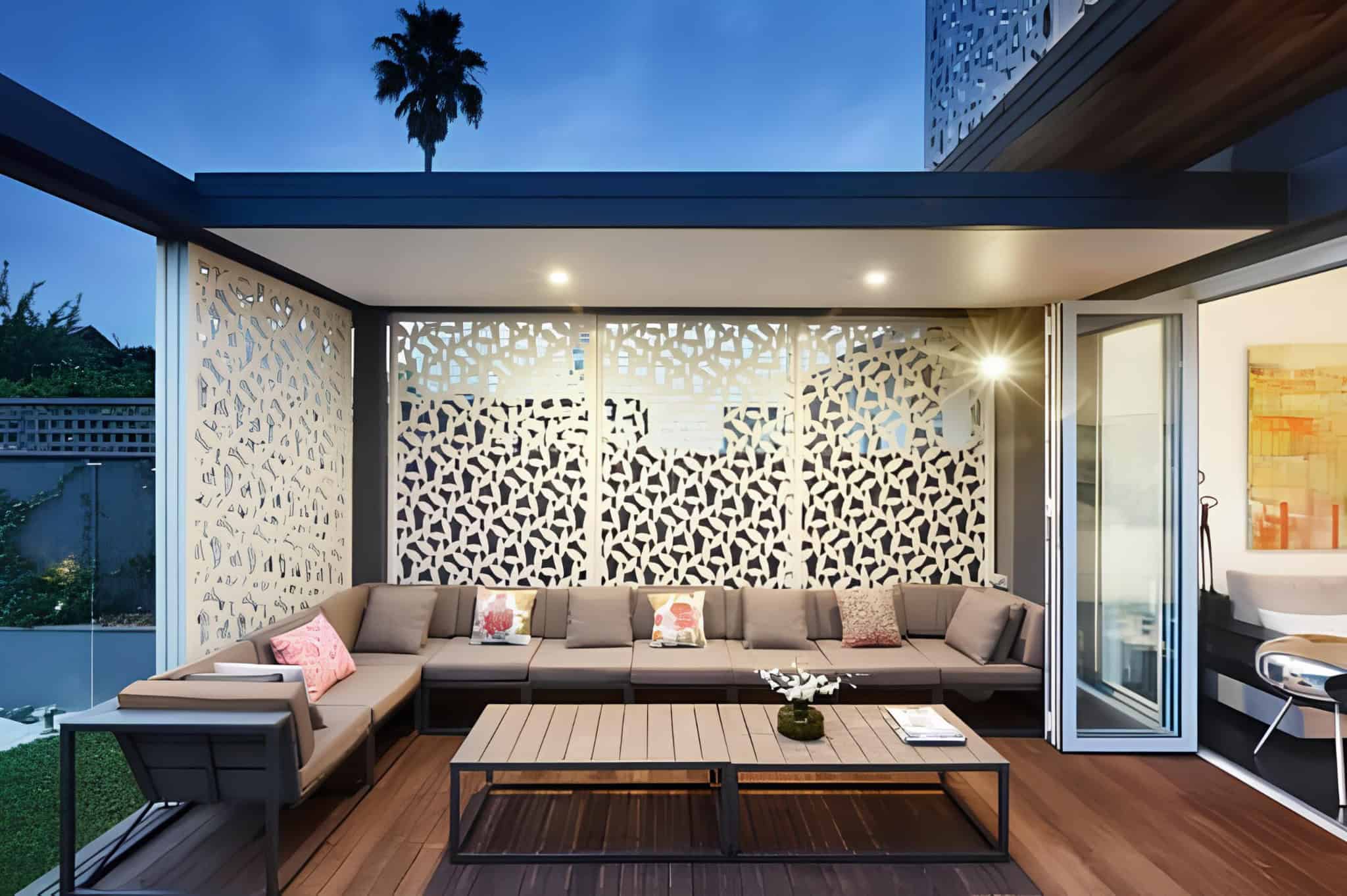 Modern patio with geometric white privacy panels and sectional seating