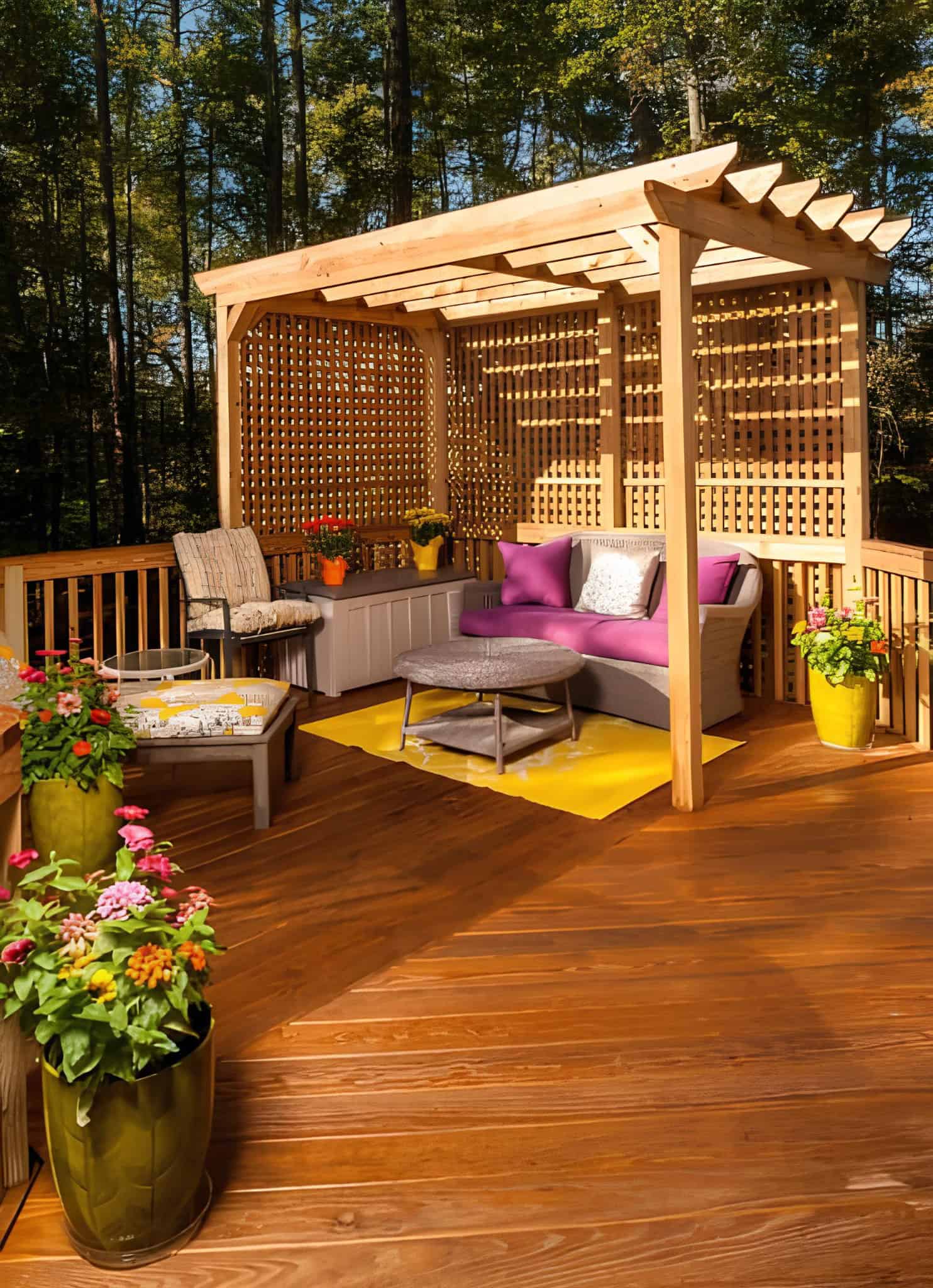 Wooden pergola with lattice privacy panels and cozy seating area on a deck