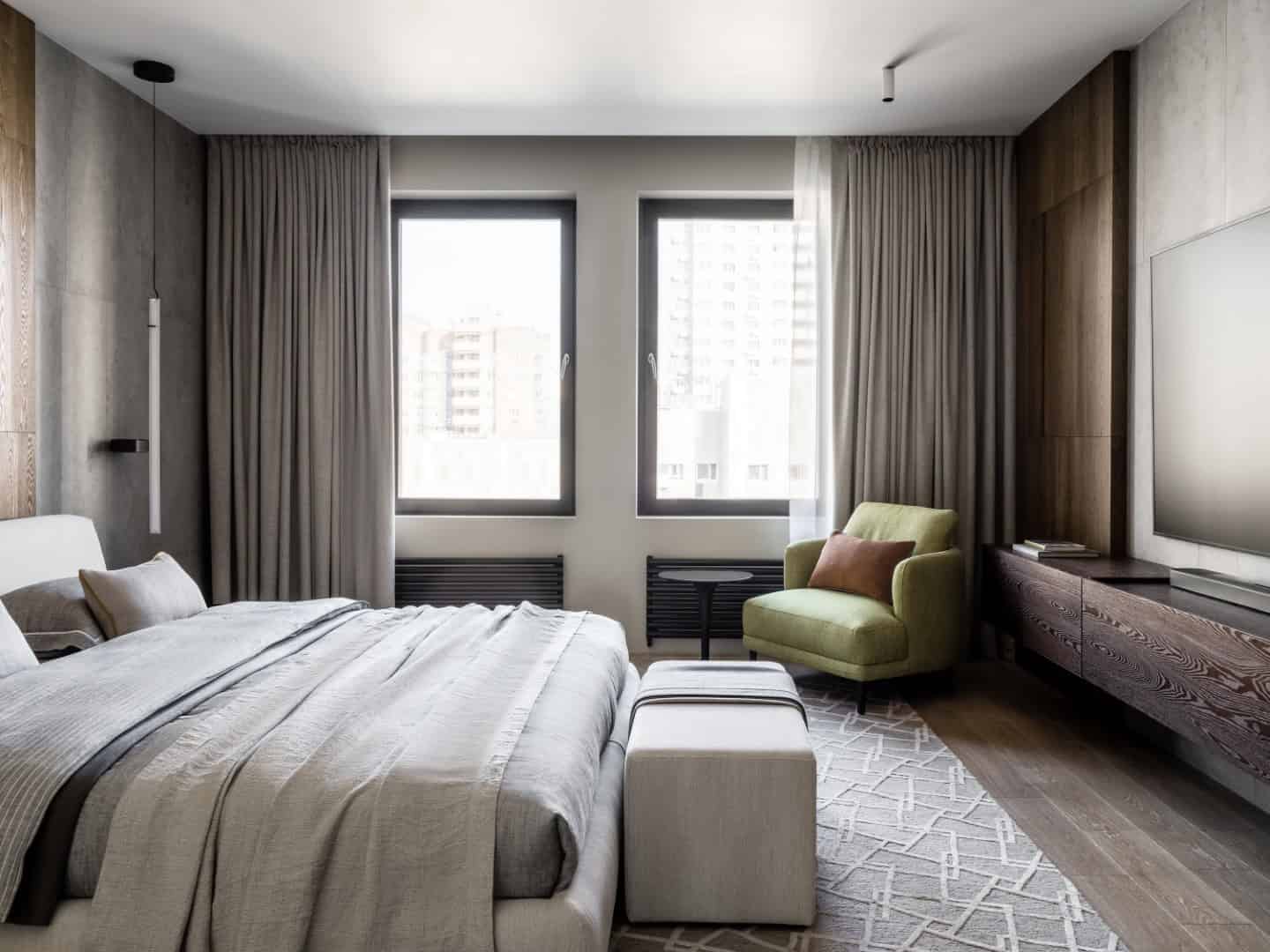 1,800 sf Apartment / Alexander Tischler / Russia Seating cluster oriented toward retractable projector screen