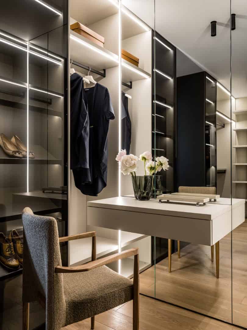 1,800 sf Apartment / Alexander Tischler / Russia Walk-in closet with backlit shelving and glass modules