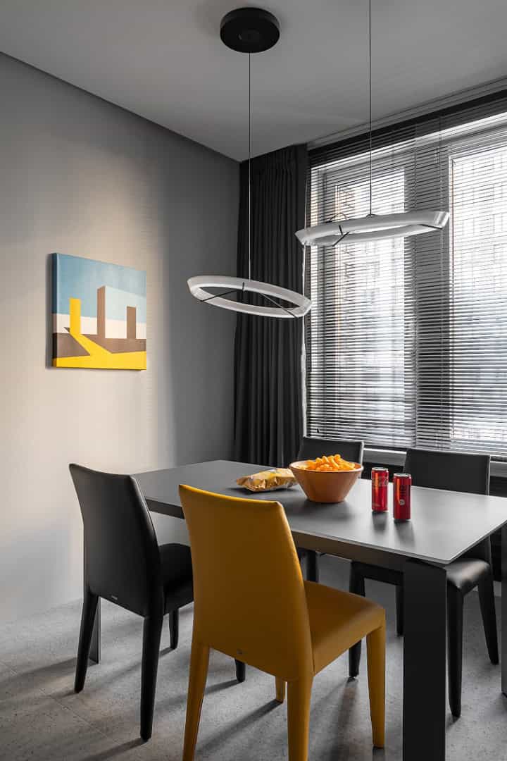Apartment for a Software Developer / Alexander Tischler / Russia Dining zone with glass table, Bontempi chairs, and Vibia lamps