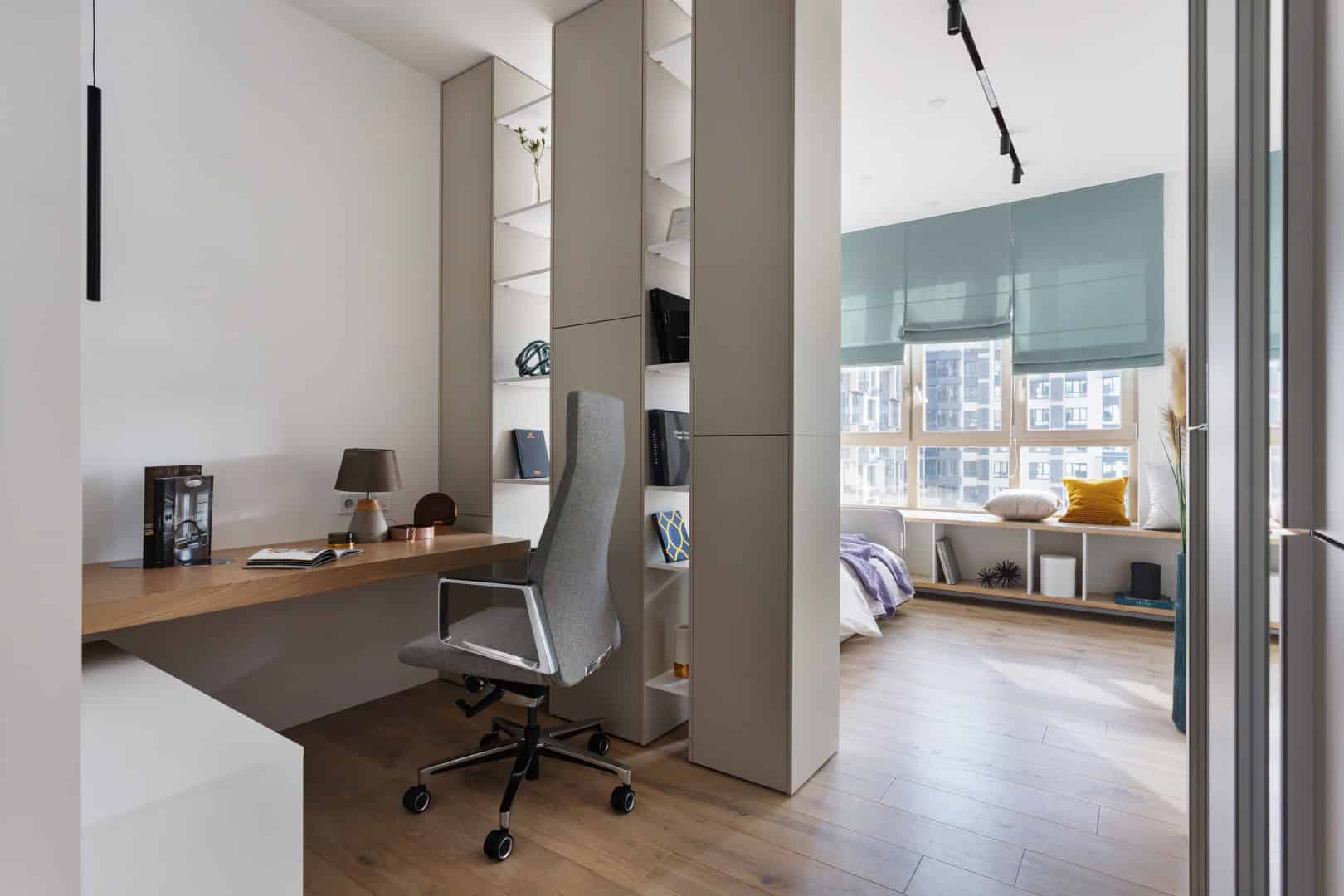 Colorful Apartment / Alexander Tischler / Russia Master bedroom with oak screen and soft lighting