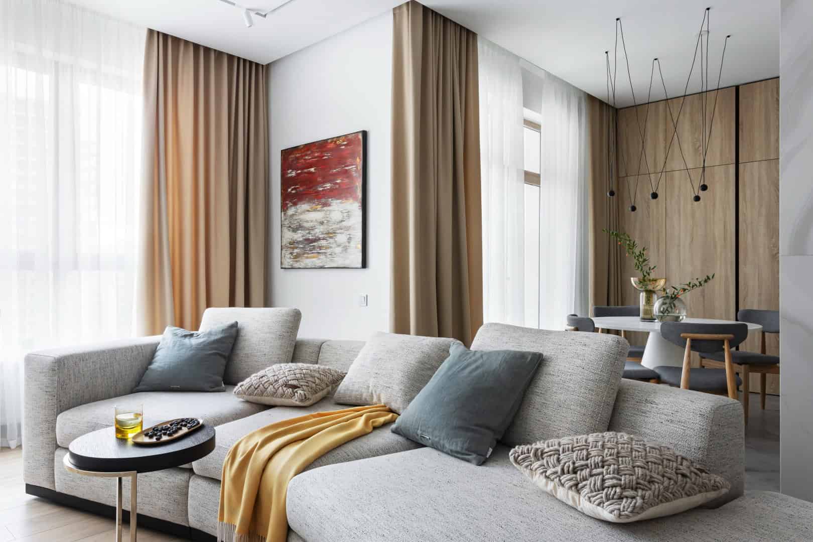 Colorful Apartment / Alexander Tischler / Russia Dining table aligned with kitchen and lounge