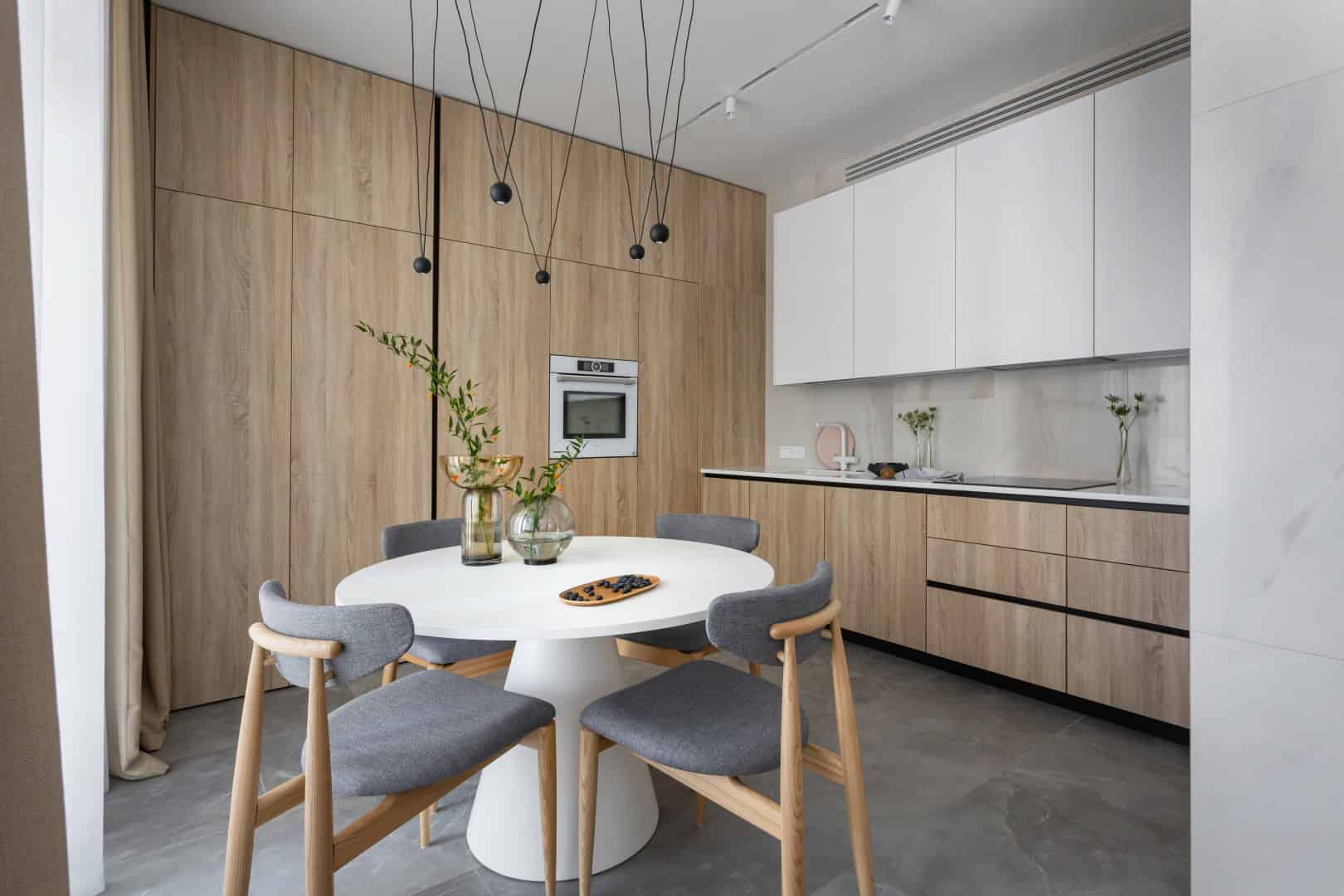 Colorful Apartment / Alexander Tischler / Russia Curved sofa anchoring the lounge with TV sightline