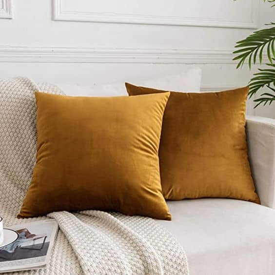 Embrace Autumn with Terracotta, Mustard, and Deep Green Cushion Combos