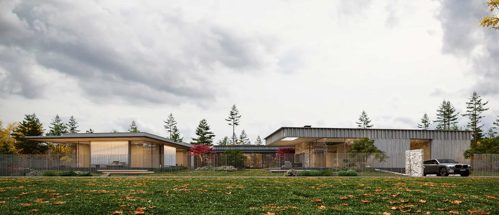 Sleek modern residential architecture with flat roofs, expansive glass windows, and a minimalist design set amidst autumn foliage.