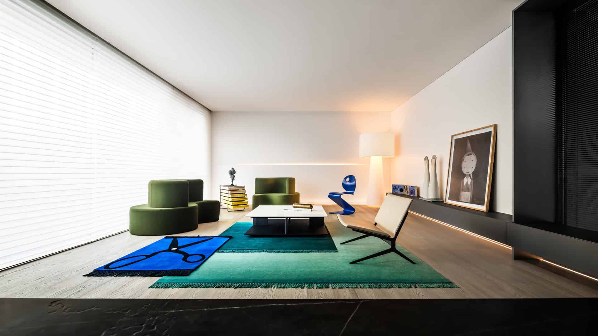 Bright modern living room with contemporary furniture, colorful rugs, and sleek decor, showcasing innovative architecture and art design elements.