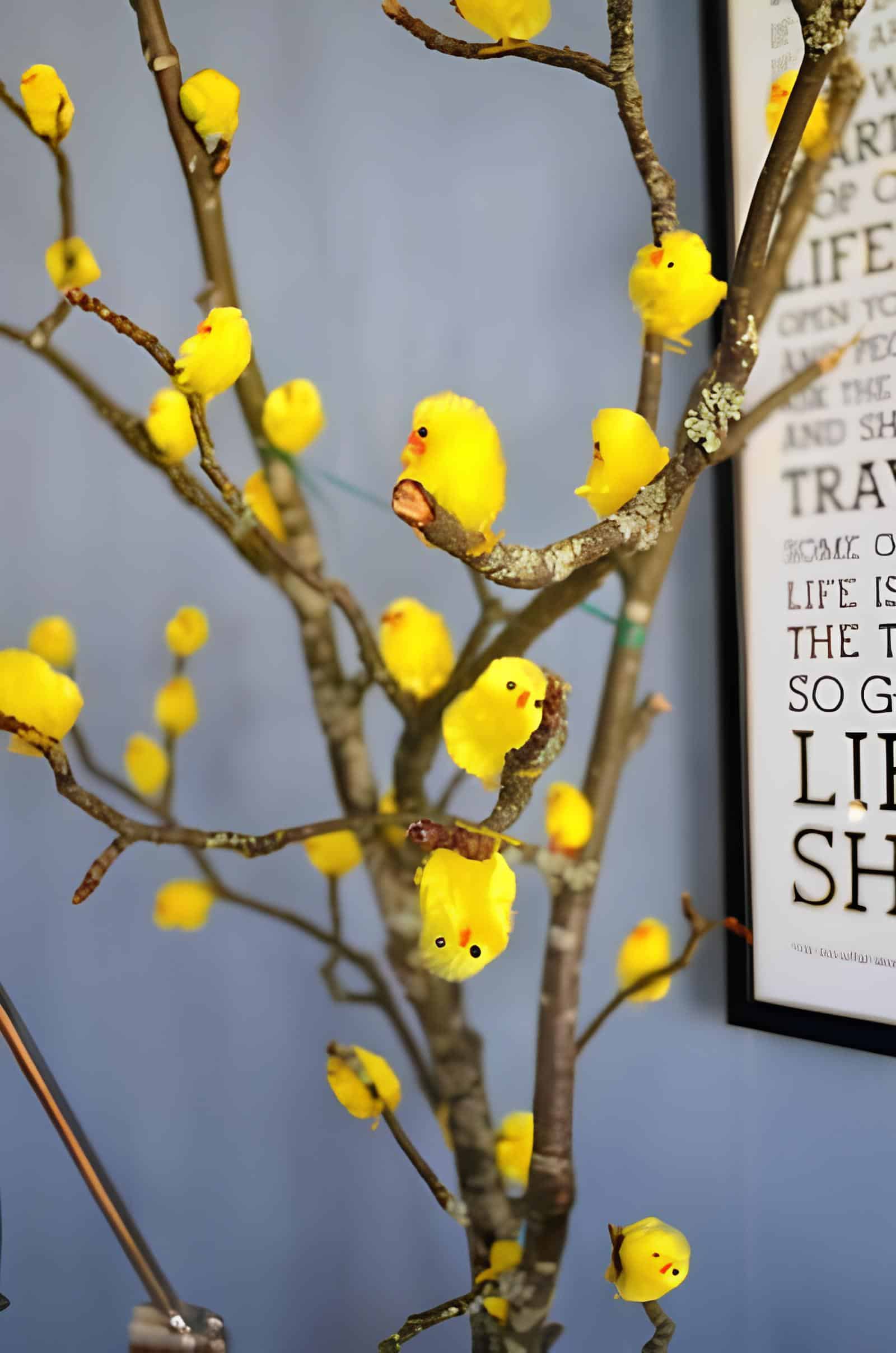 10. Easy Dollar Store DIY Easter Tree with Chicks DIY Easter tree decorated with natural branches and mini yellow chick figurines for a cheerful spring centerpiece – simple and creative Dollar Tree Easter craft idea.