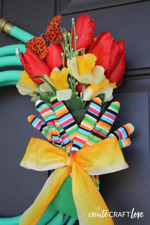 15. DIY Spring Garden Hose Wreath Porch Decor