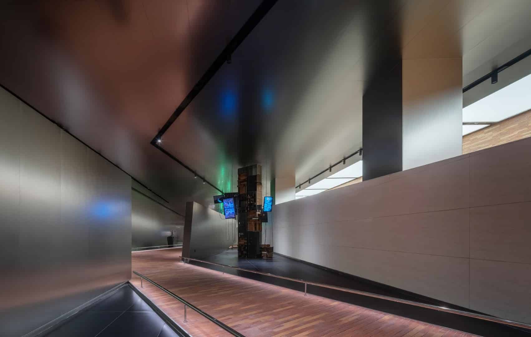 Ceiling as Surface Mirrored ceiling multiplying exhibits and movement for an expanded field of view.