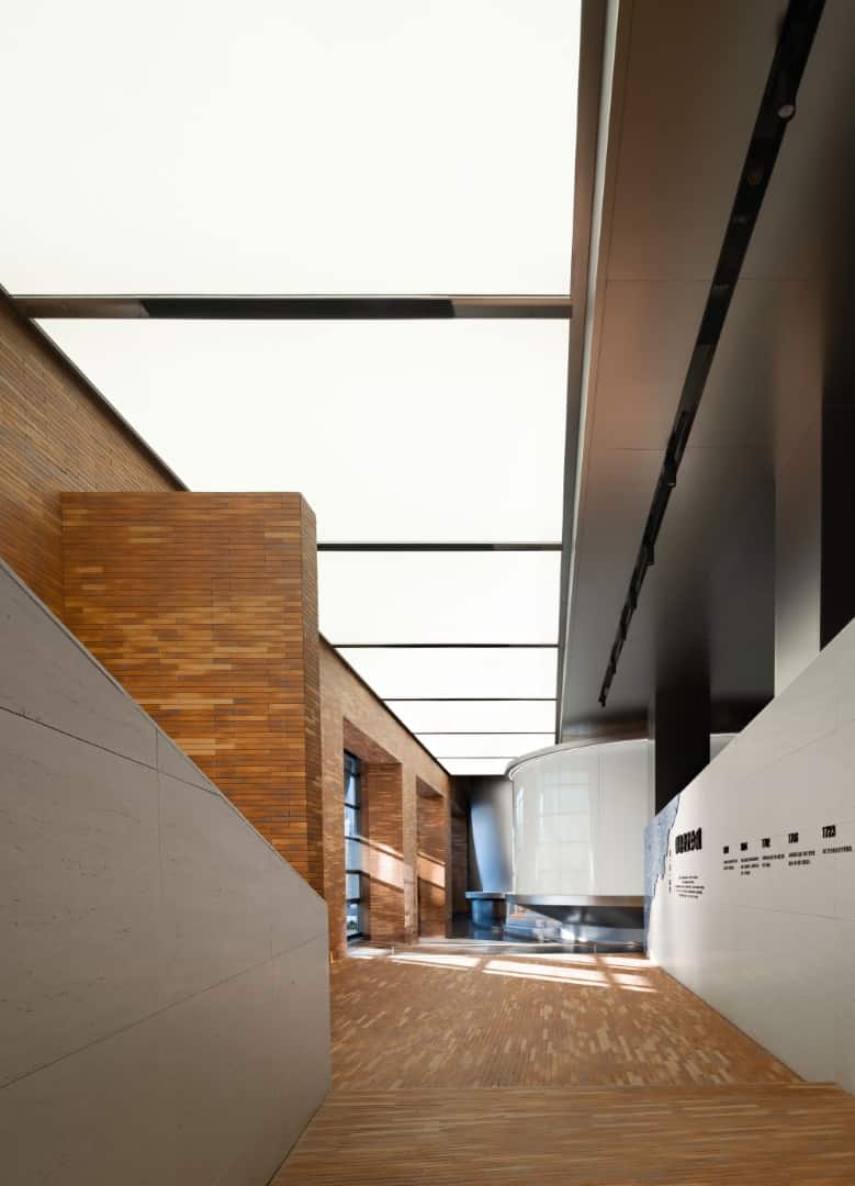 Reflective Foyer Entry foyer with mirrored walls and stainless elements establishing a ceremonial tone.
