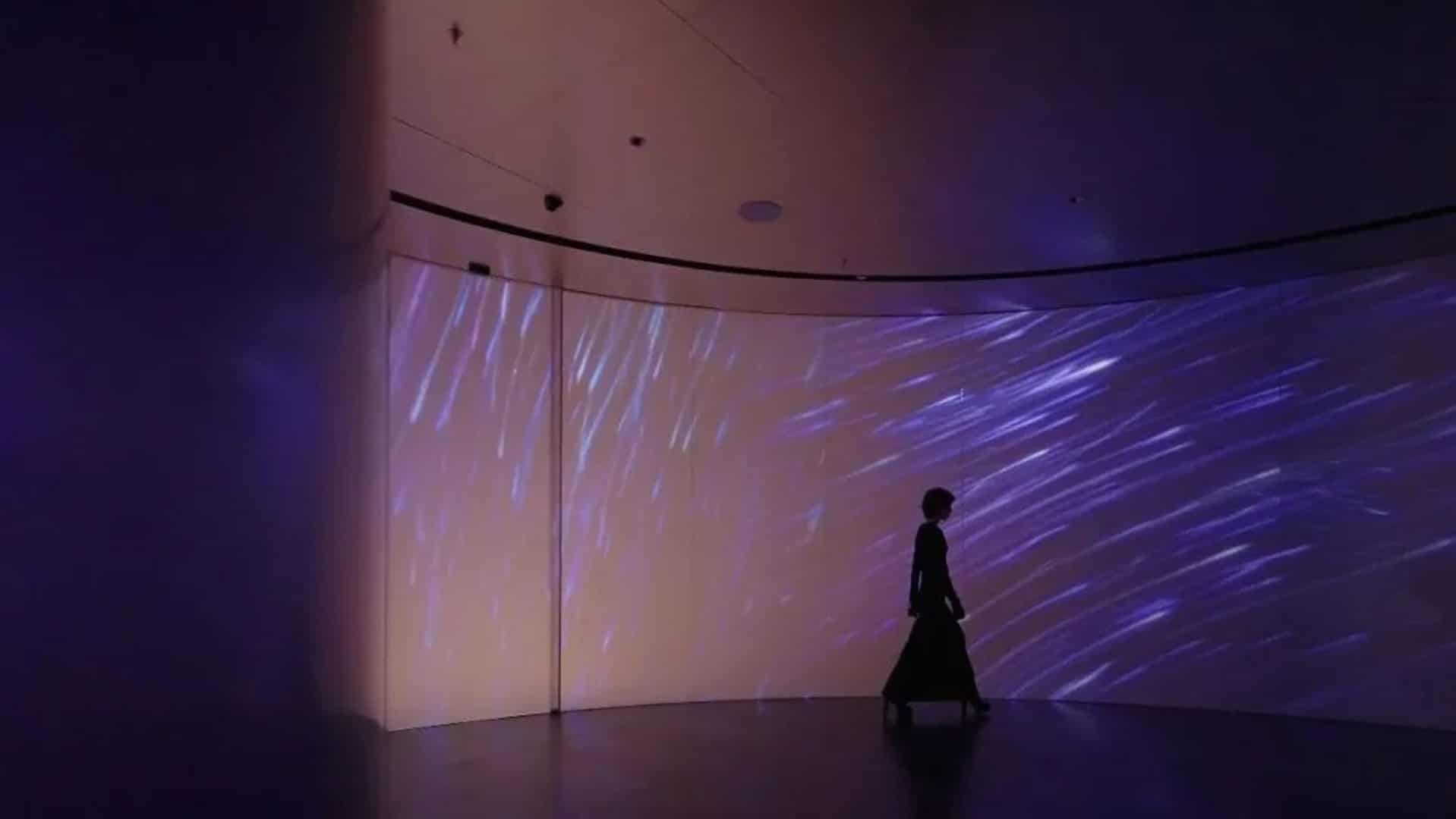 Brand Timeline Exhibit wall layering archival material and media into a brand timeline.