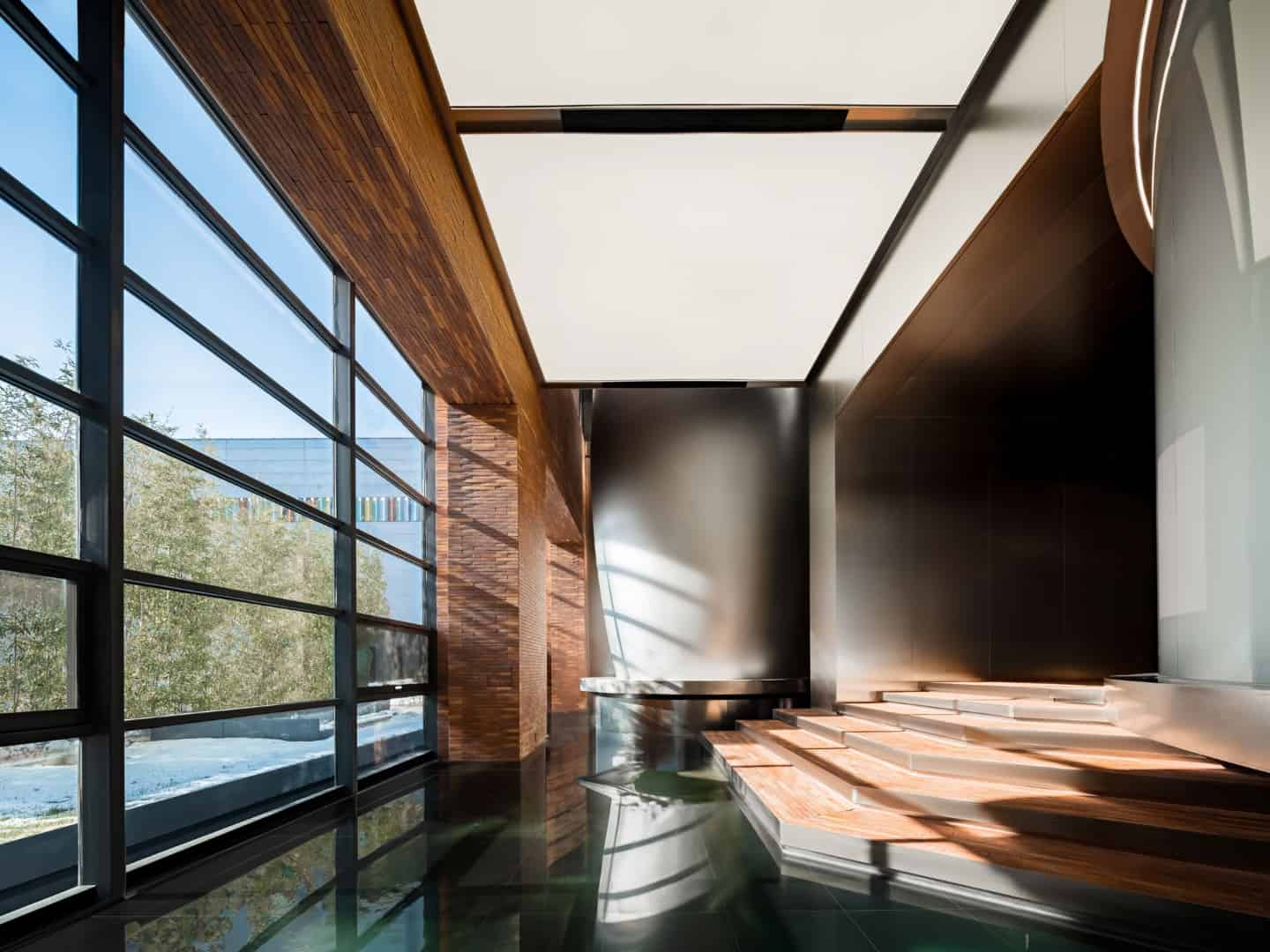 Curved Corridor Sequence Curving corridor lined with reflective materials guiding visitors through thematic zones.