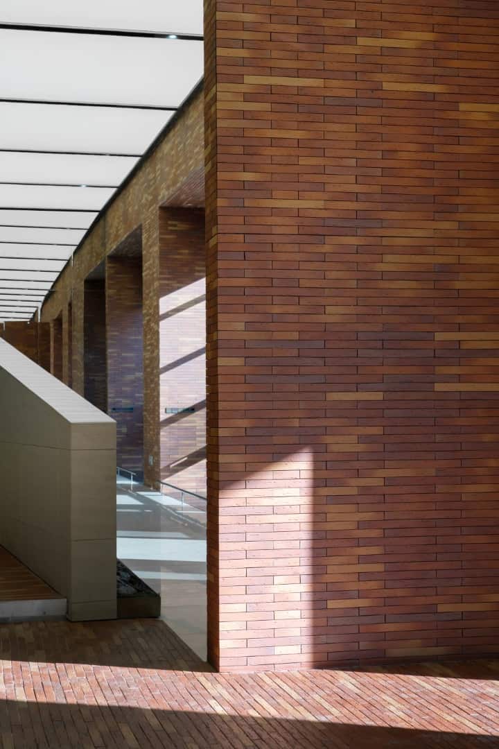 Mirrored Continuities Reflective corridor expanding perceived depth and continuity of space.