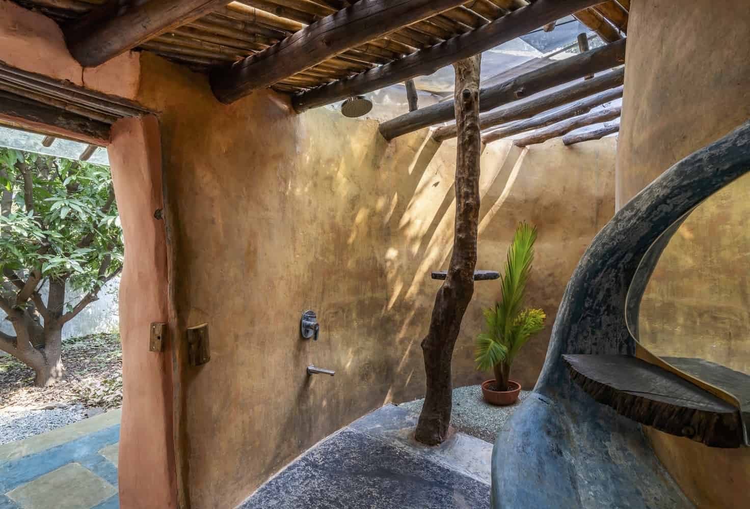 Evening Glow Warm interior light radiating through earthen openings at dusk in the forest clearing.