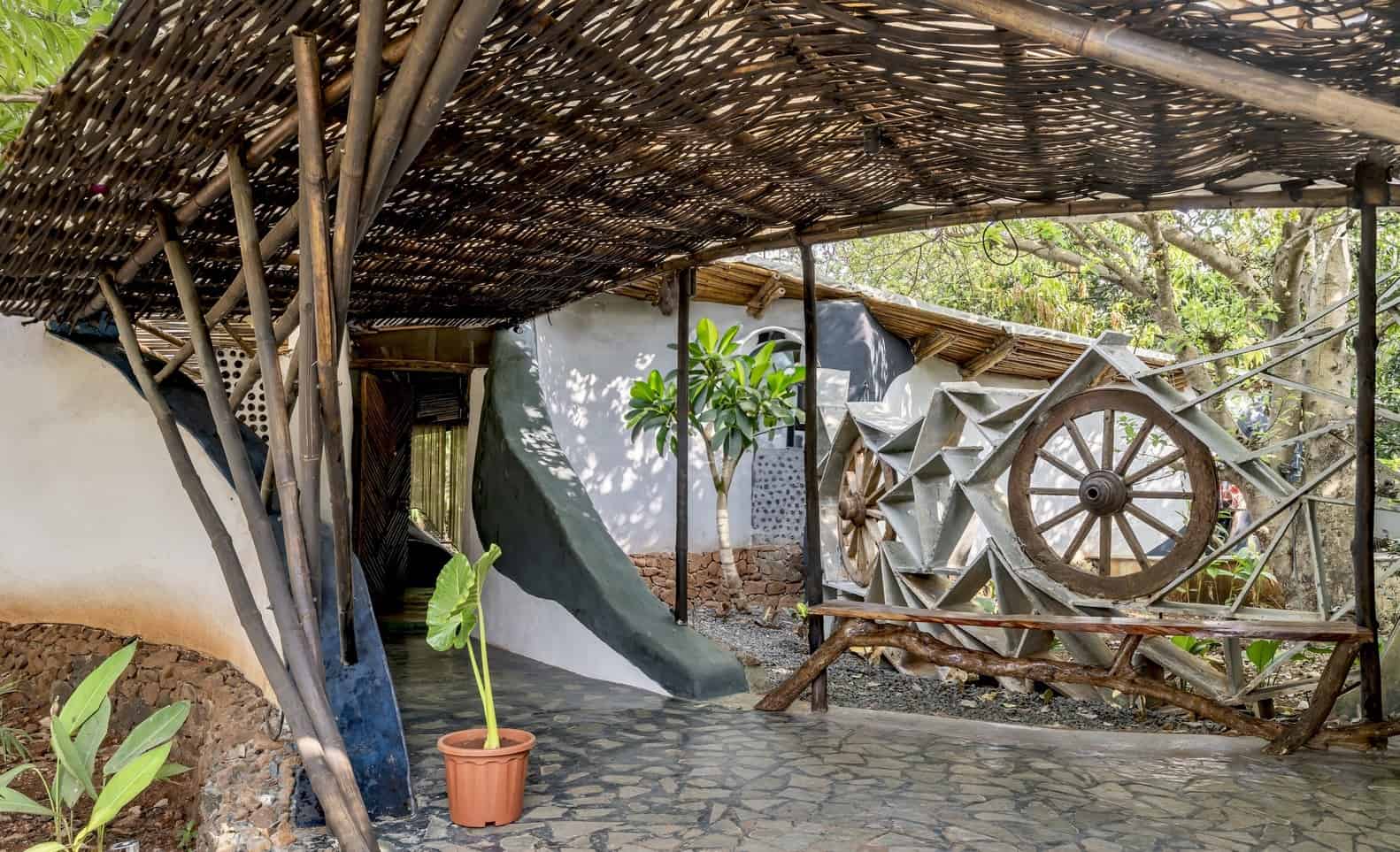 Sinuous Passageways Curving corridor in earthen plaster guiding movement between courtyards and rooms.