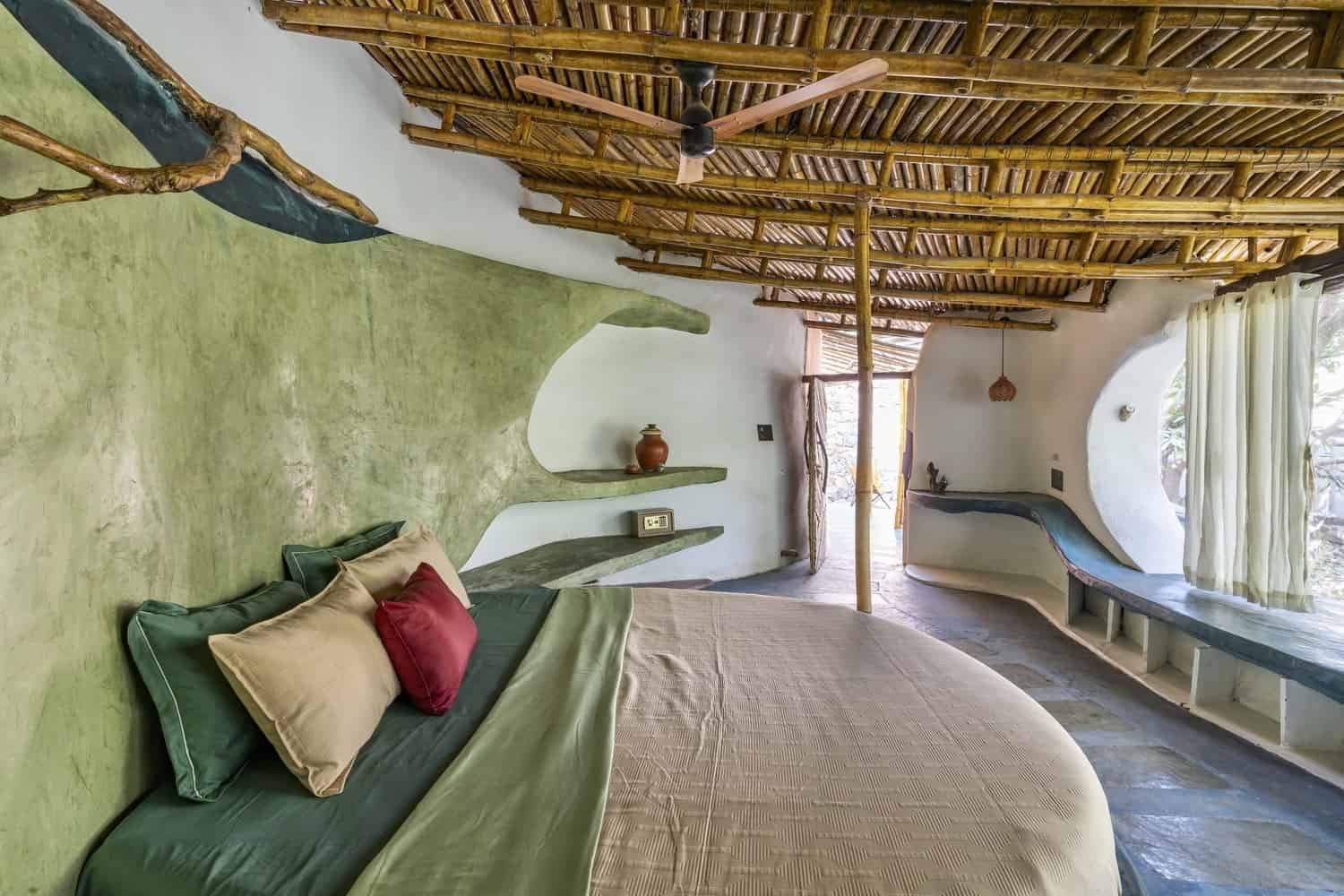 Ventilation Cuts Narrow vertical openings drawing air through earthen interiors for passive cooling.