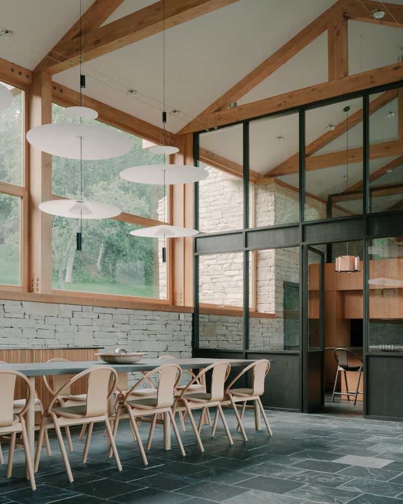 Calm Interiors Minimal interior composition balancing rough stone with smooth wood and plaster finishes.