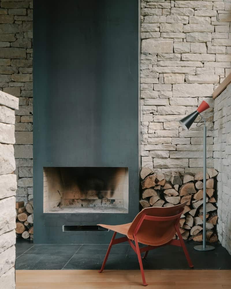 Bedroom Quietude Bedroom with oak floors, soft plaster walls, and narrow clerestory light for privacy and calm.
