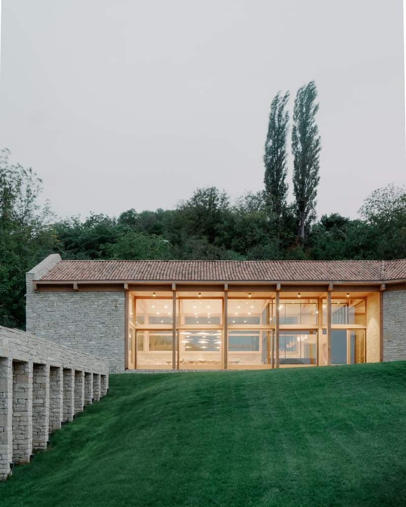 Social Wing — Framing the Hills Glazed living and dining wing with floor-to-ceiling windows overlooking the Georgian countryside.