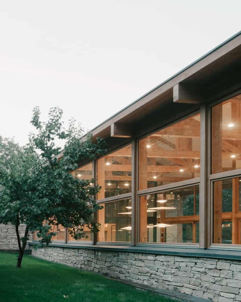 Landscape as Interior Backdrop Living room view where the landscape reads as part of the interior composition through large glazing.