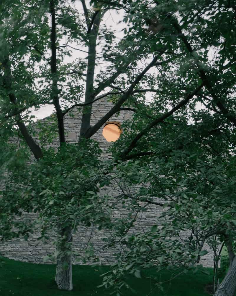 Stone Craft & Timber Detail Close-up of hand-laid stone façade with timber soffit and precise junctions.