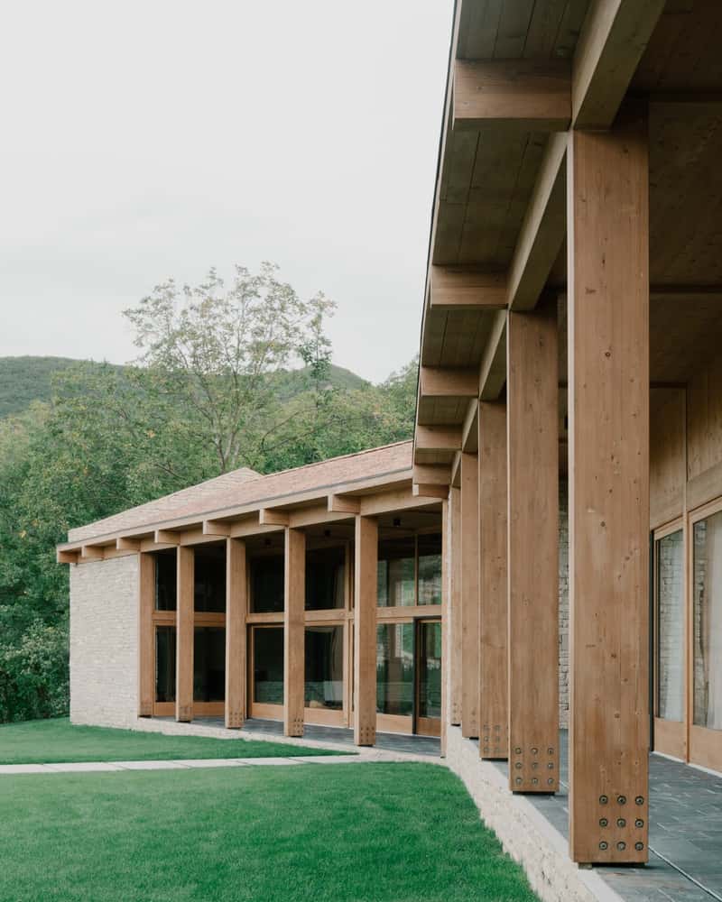 Tactile Interior Palette Interior composition of stone, wood, and glass with softly modulated daylight.