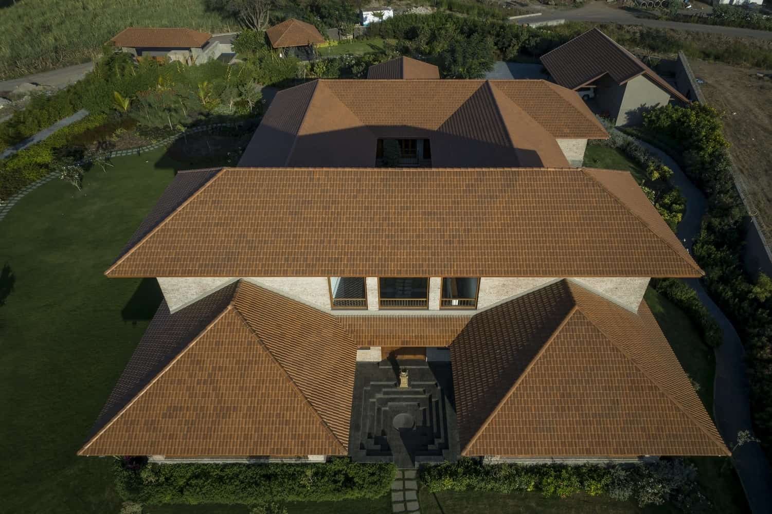 Handmade Surfaces Detail of exposed mortar joints and handmade brick textures catching angled light.