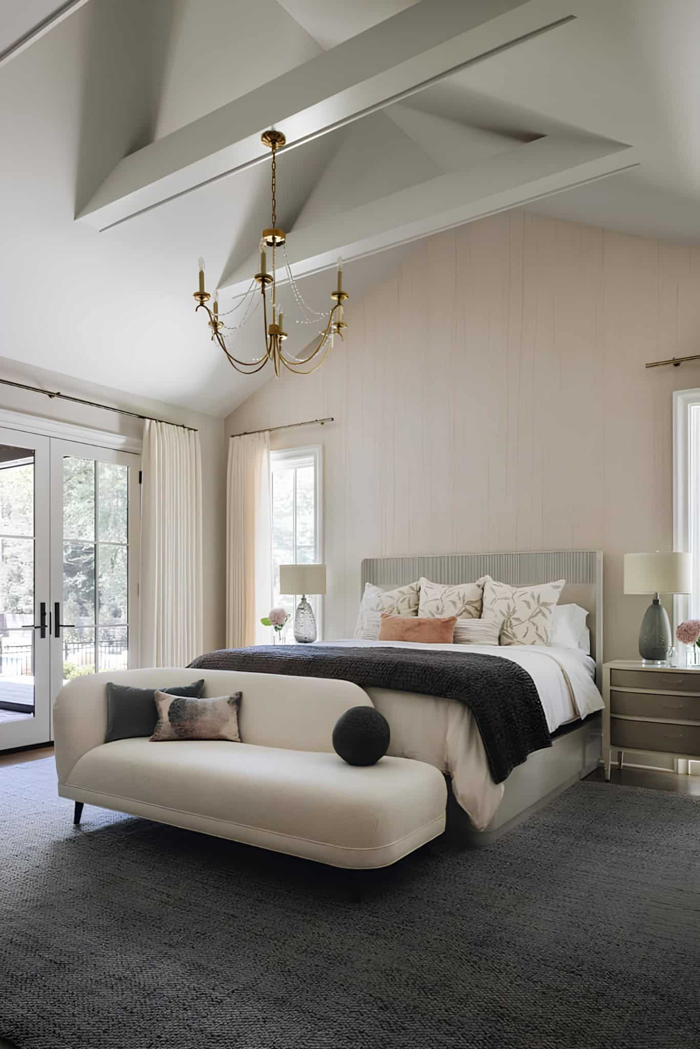 Mediterranean Bedroom Chicago Bright bedroom with vaulted ceiling, neutral palette, and elegant furnishings.