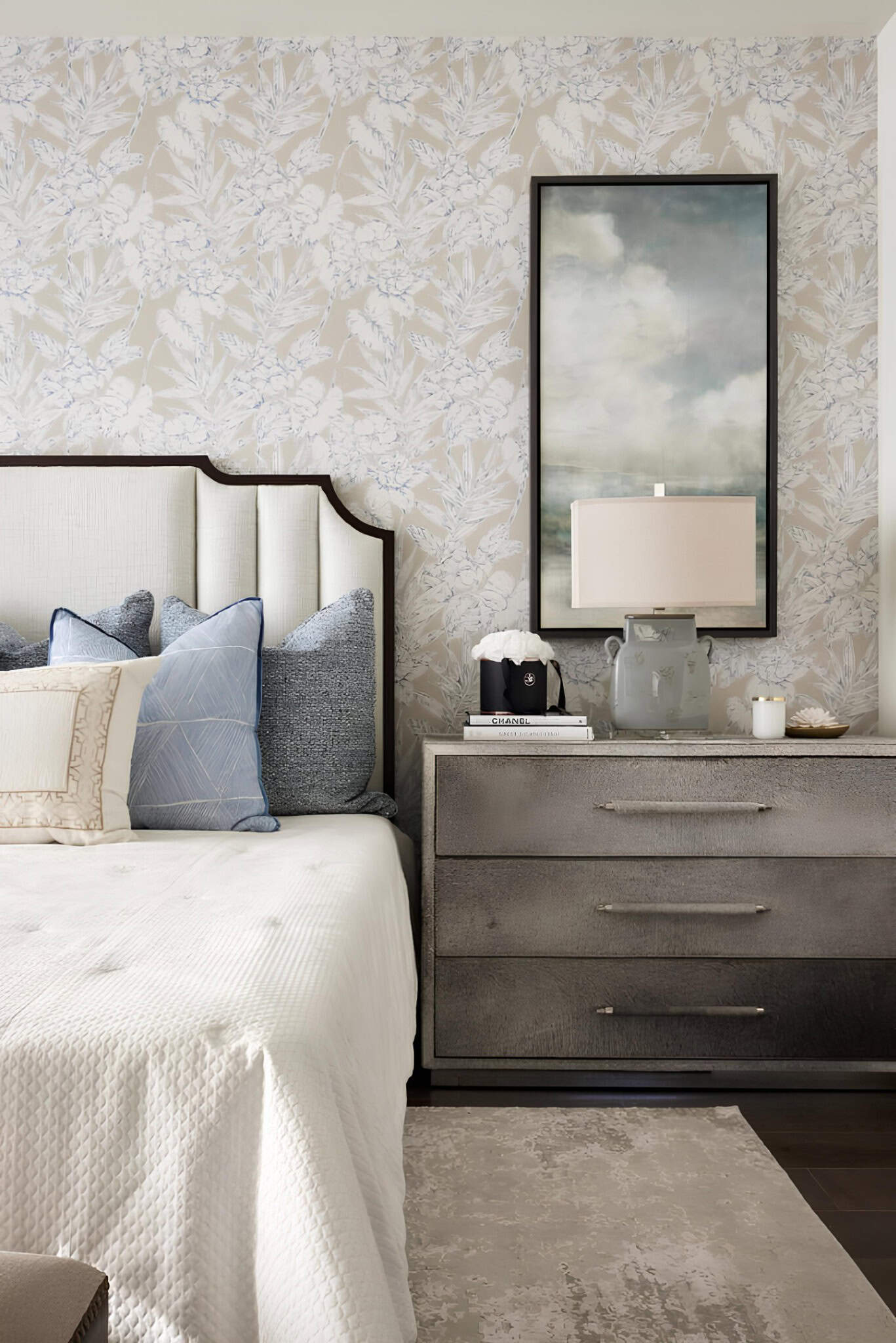 Mediterranean Bedroom Wallpaper Accent Textured Mediterranean bedroom with floral wallpaper, designer pillows, and bedside decor.