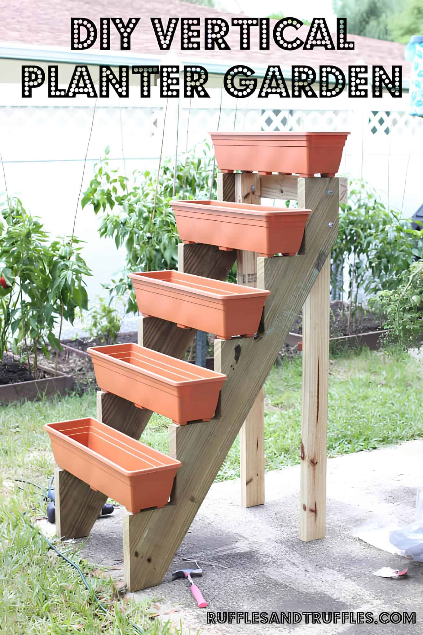 Wooden staircase planter stand with orange flower boxes