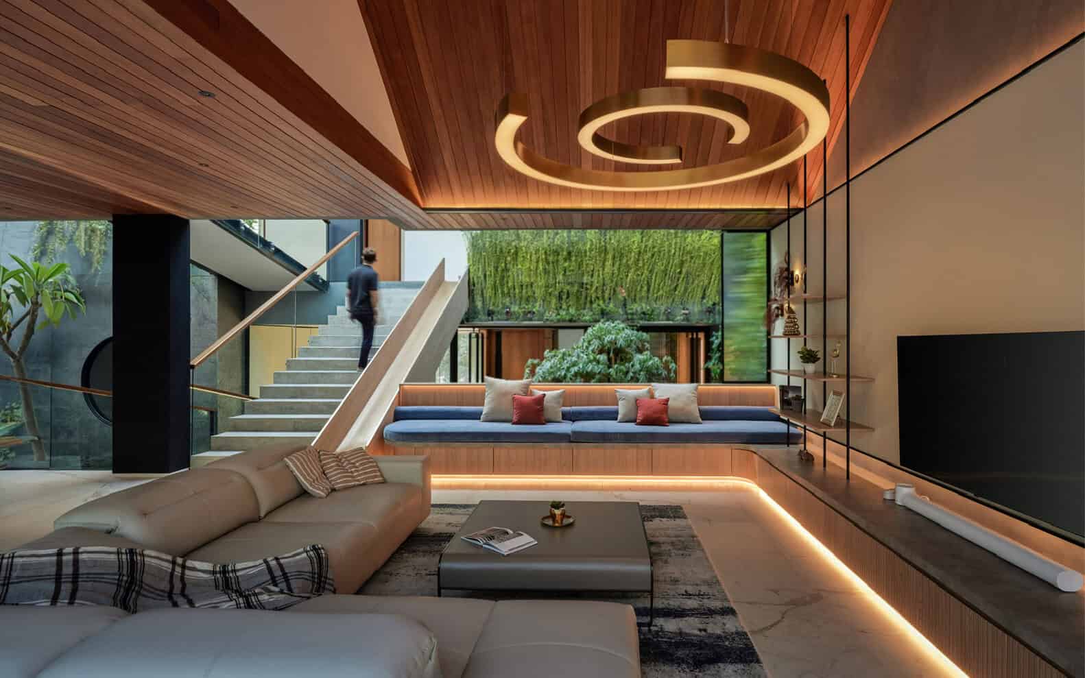 The modern living room has a spiral staircase