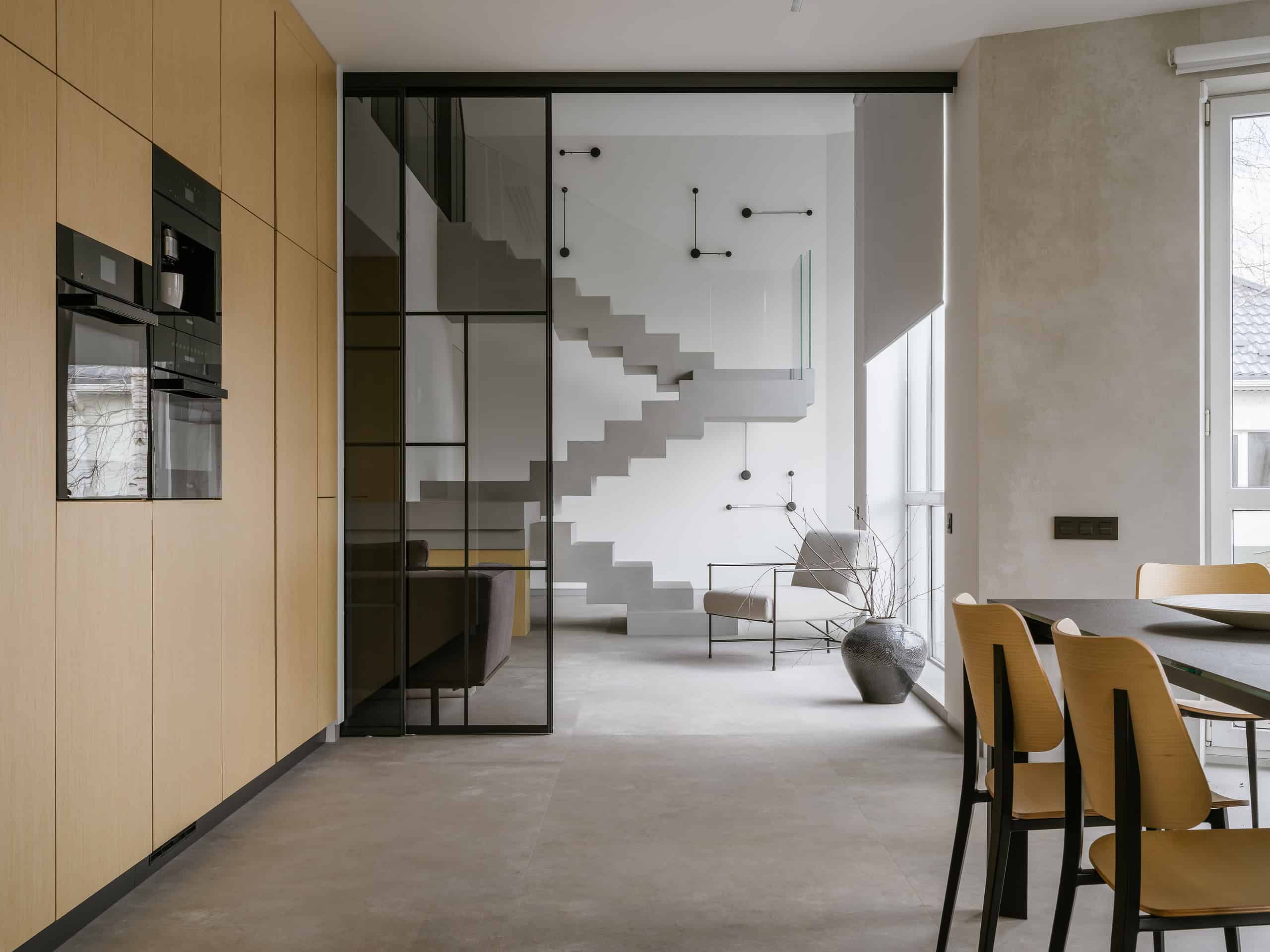 The House with a Soaring Staircase: A Minimalist Renovation by Makedesign Studio The House with a Soaring Staircase: A Minimalist Renovation by Makedesign Studio