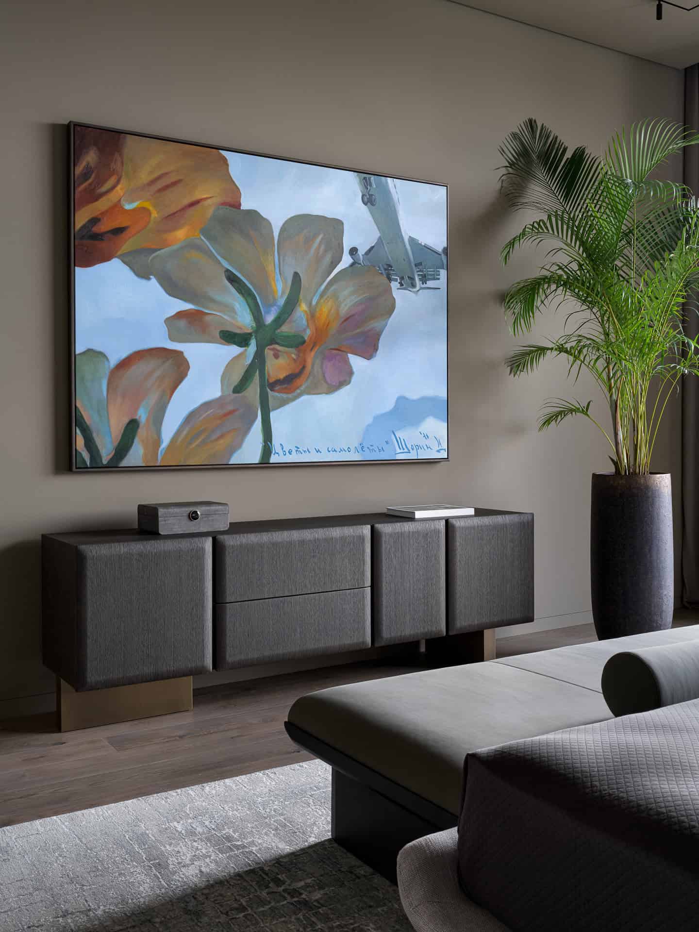 Bedroom Media Console with Art Contemporary bedroom featuring a media console and a vibrant floral painting.