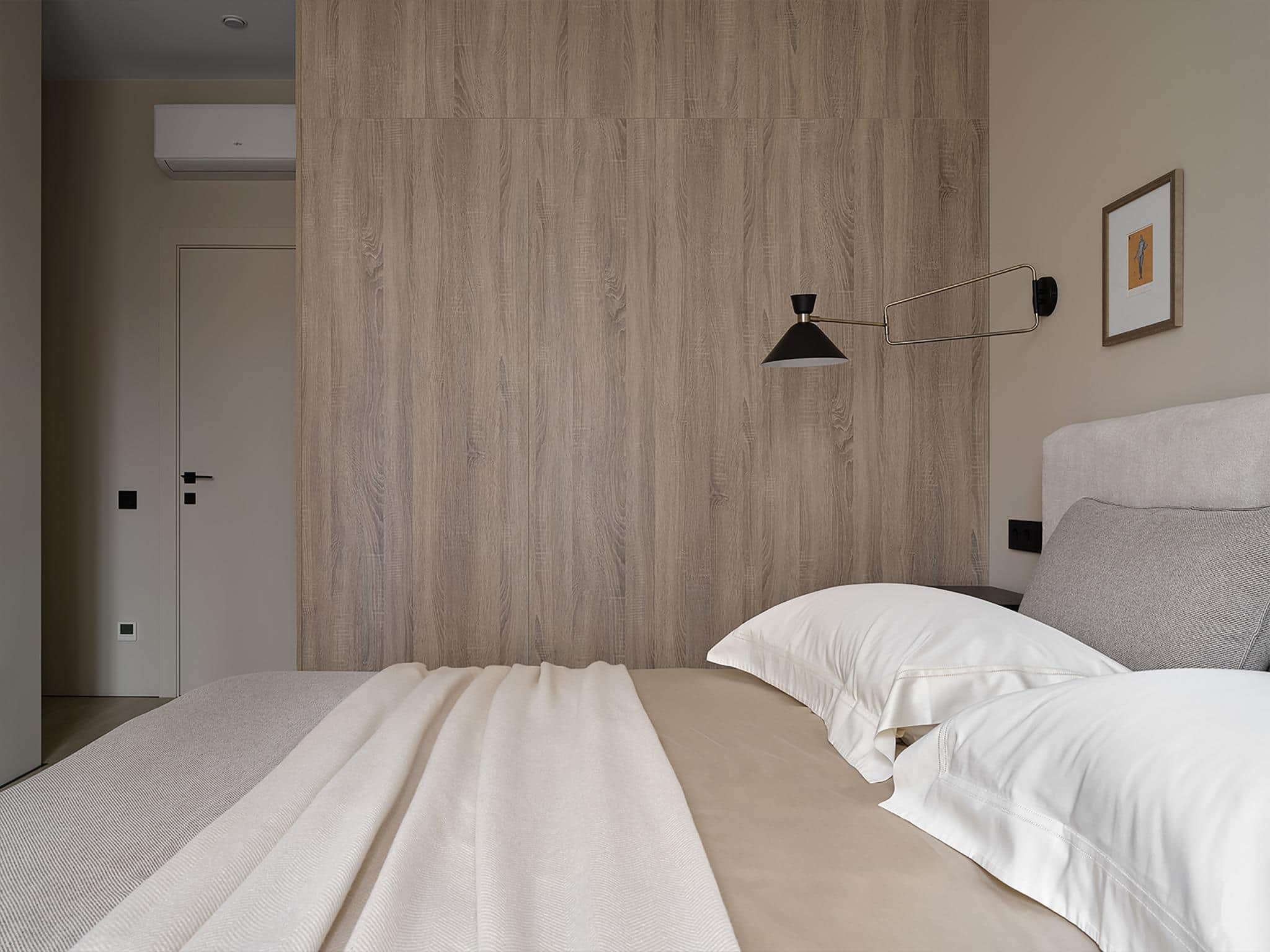 Beige Bedroom with Wood Paneled Accent Wall Beige bedroom interior featuring a wood-paneled accent wall and modern lighting.