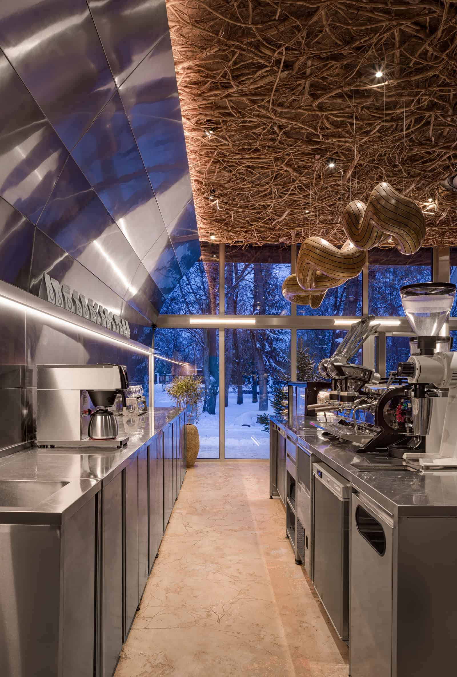Coffee Shop Kovel Bar Ceiling Wood Lighting Counter bar illuminated by wooden lights and rustic ceiling of woven branches