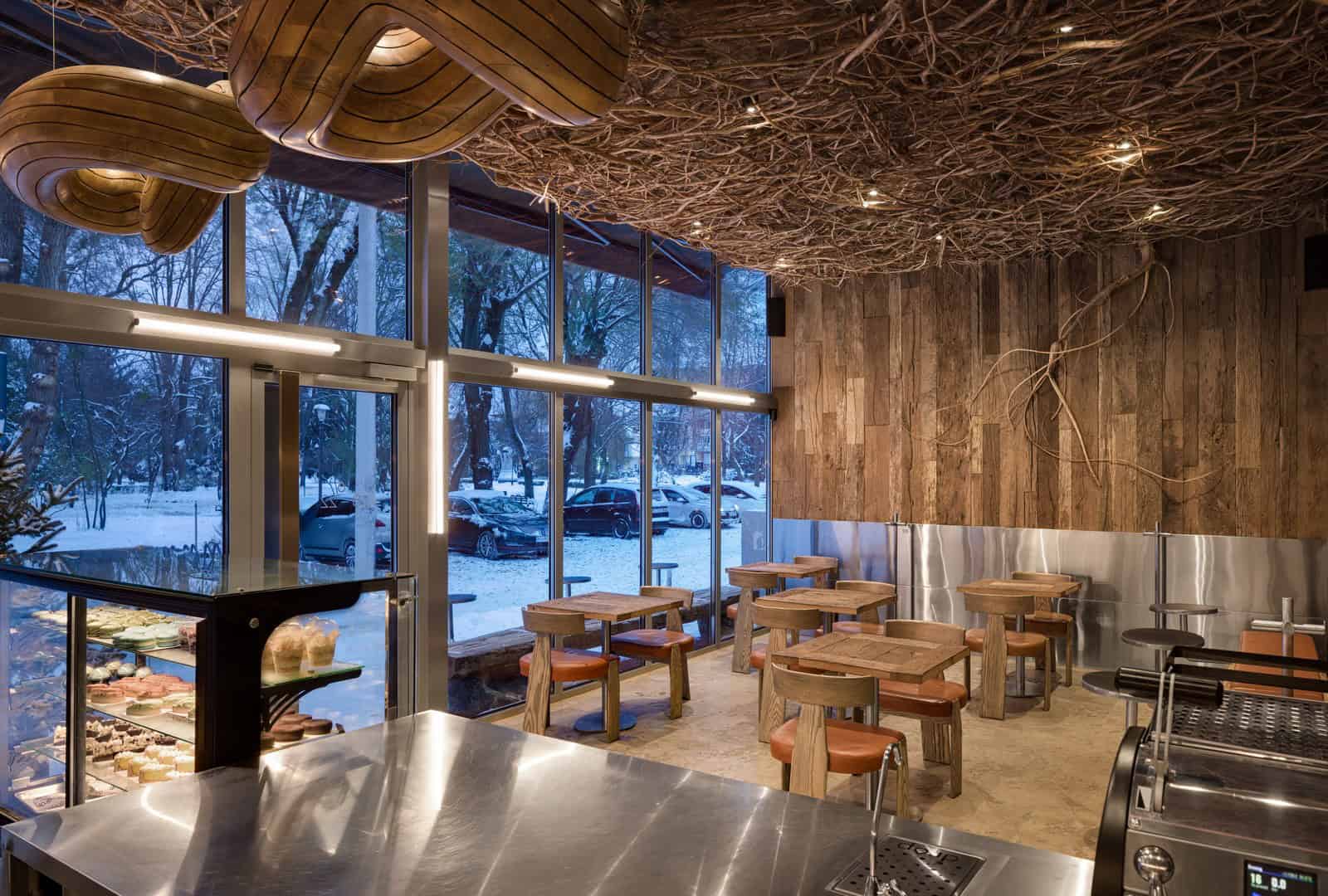 Coffee Shop Kovel Evening Ambience Interior Warm evening light filling a rustic coffee shop with twig ceiling and wooden decor